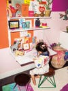 Little girl sitting at desk