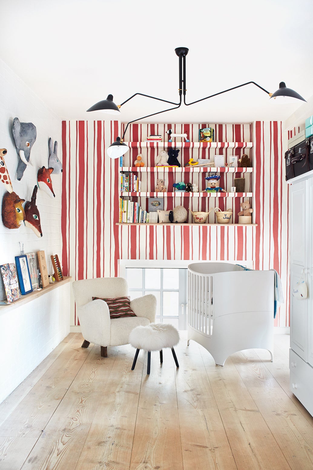 Kid's room with striped red and white wallpaper