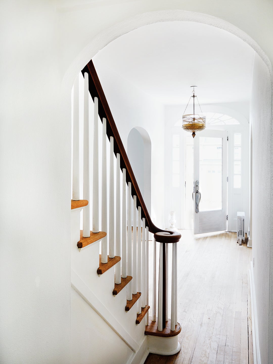 White staircase with black railing