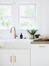 white kitchen with white farm sink