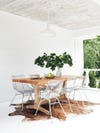 Wood dining table with white chairs