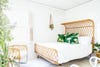 rattan bed frame in white bedroom