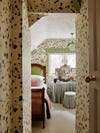 bedroom covered in vine wallpaper