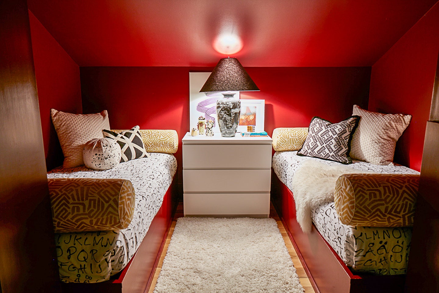 red room with two twin beds