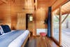 wood-paneled houseboat bedroom