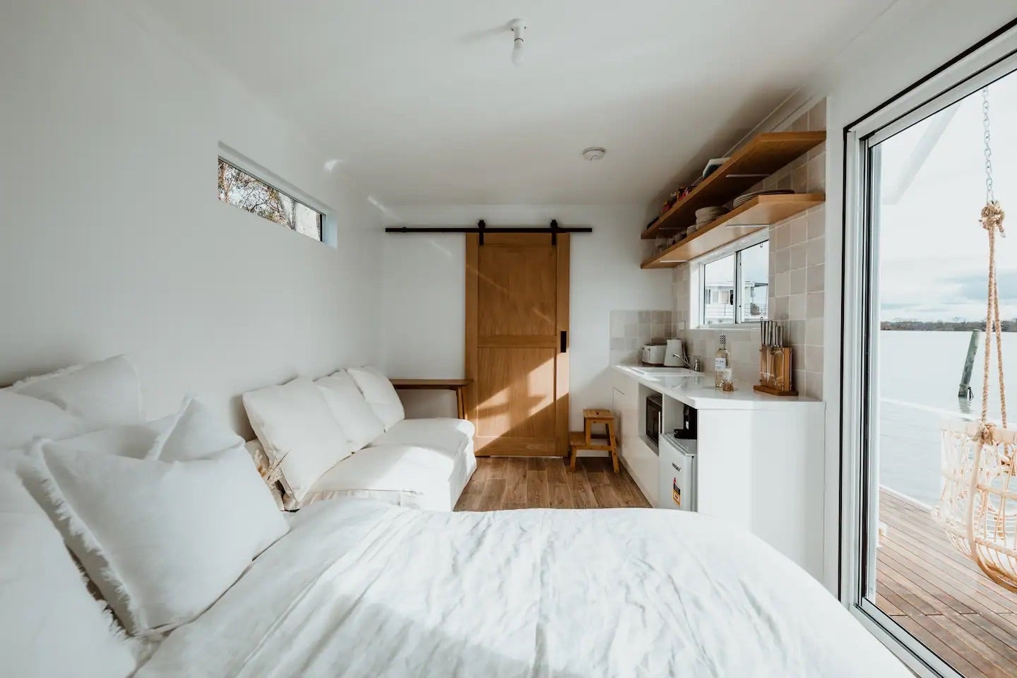 houseboat white living area and bedroom
