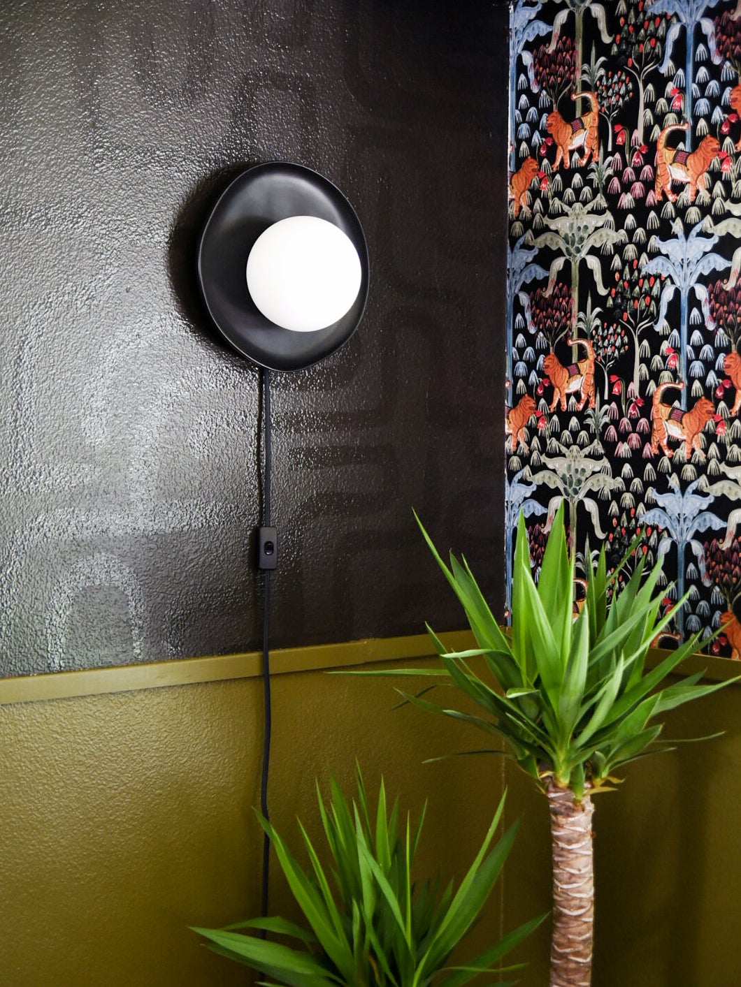 black plated wall sconce