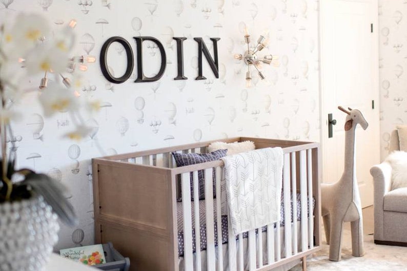 nursery with name odin on the wall