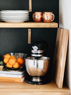 butcher block counters and black wall