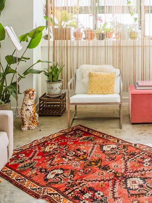 living room with rug on top of rug