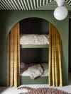 Dark sage green kid's bed room with arched bunk bed and striped ceiling. 