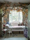 Girl's room with faux forest branches made into a bed canopy. 