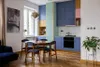 Color blocked kitchen cabinets with sage green, pink, and blue.