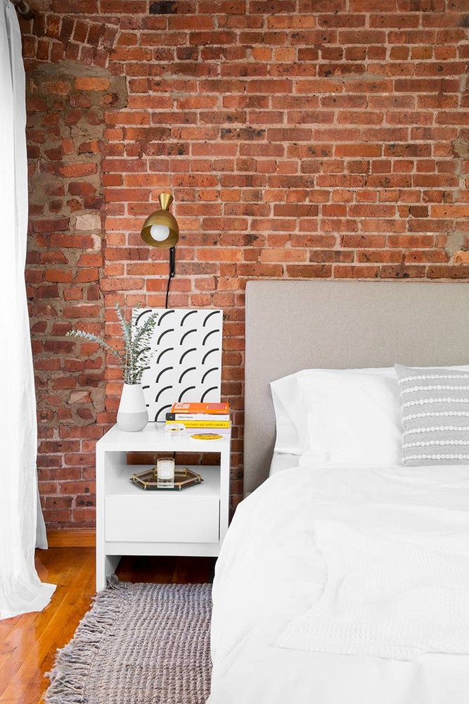 uprise art  bedroom with brick wall