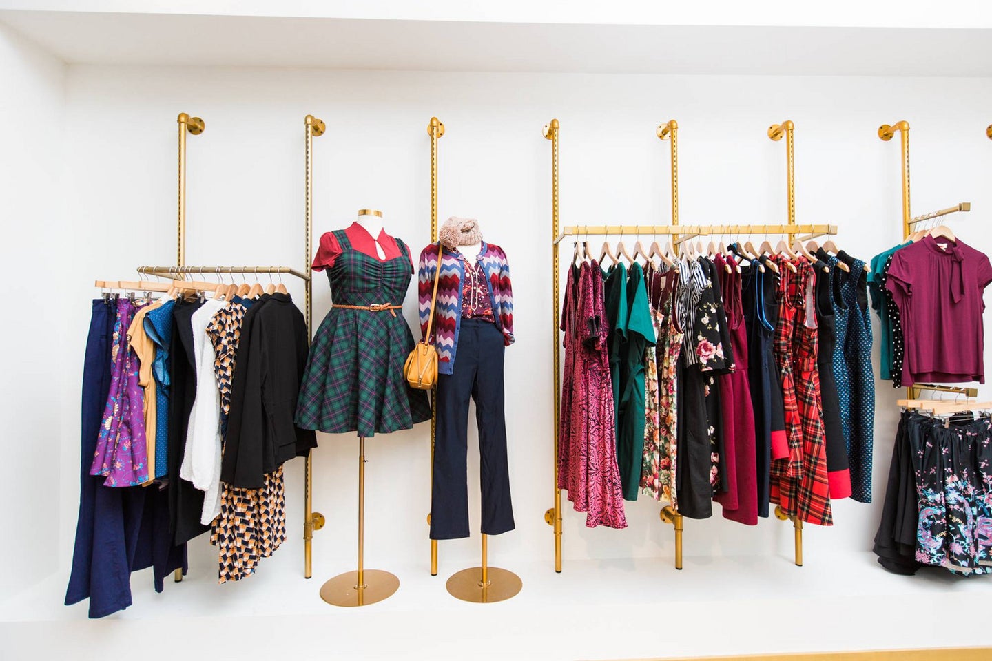 modcloth store white wall with clothing display