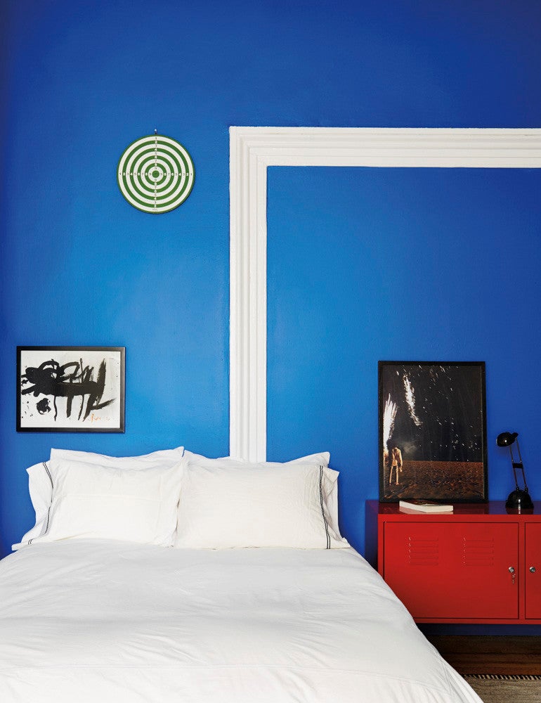 blue bedroom with red console