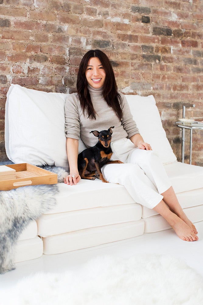 Renovating a Bathroom Turned This Apartment Into a Dream Home yao and her puppy