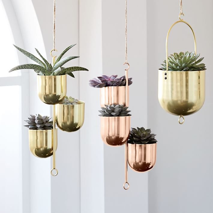 <a href="https://www.westelm.com/products/hanging-metal-planters-d4392/?pkey=cplanters&isx=0.0">Hanging Metal Planters</a>, $59<br />
