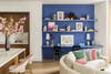 blue built in office wall in an open floor plan living room