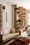 open living area with custom wood shelving