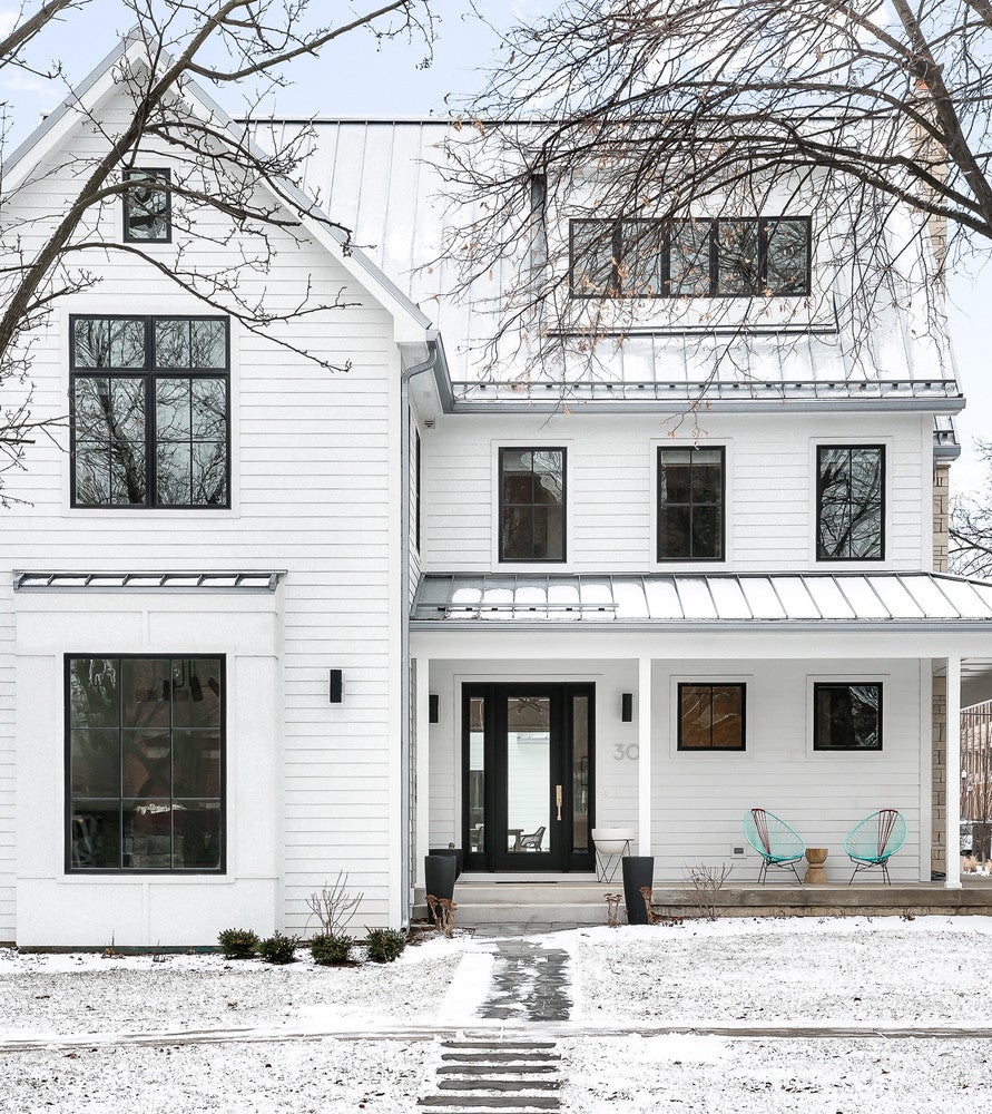 Take a cue from <a href="https://www.domino.com/content/scandinavian-farmhouse-naperville-historic-district-home-tour/">this home</a> by <a href="https://www.diomededesign.com/">Diomede Design</a> founder, Elizabeth Diomede. The black door increases its value by $6,271.