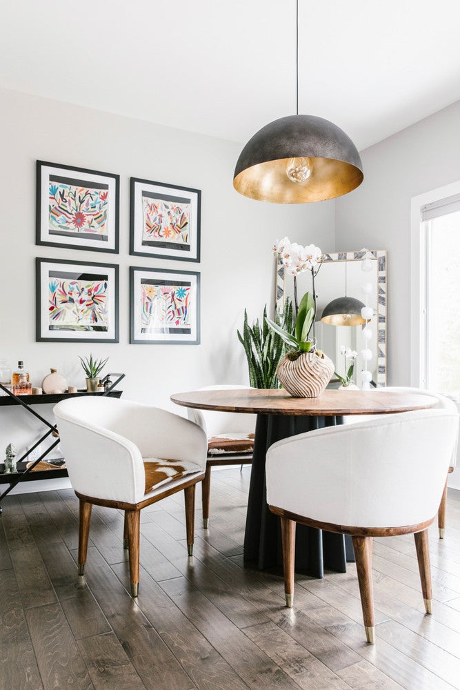 Every fixture in <a href="https://www.domino.com/content/modern-global-inspiration-north-carolina-home-tour/">this eclectic North Carolina home</a>—from the matte black pendant over the kitchen dining table to the acrylic starburst stunner in the office—is on trend. 