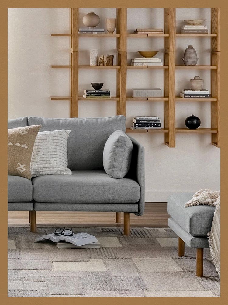 Lifestyle shot of Burrow Wall Shelves Behind Sofa with Border Treatment