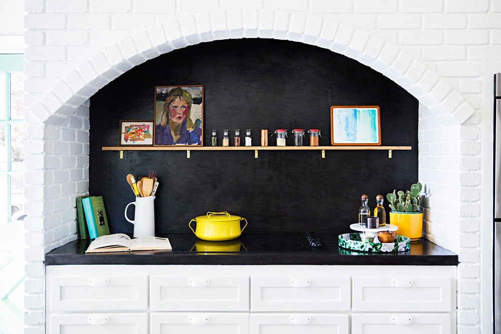 black kitchen countertop in alcove