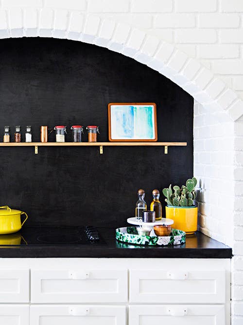 black kitchen countertop in alcove
