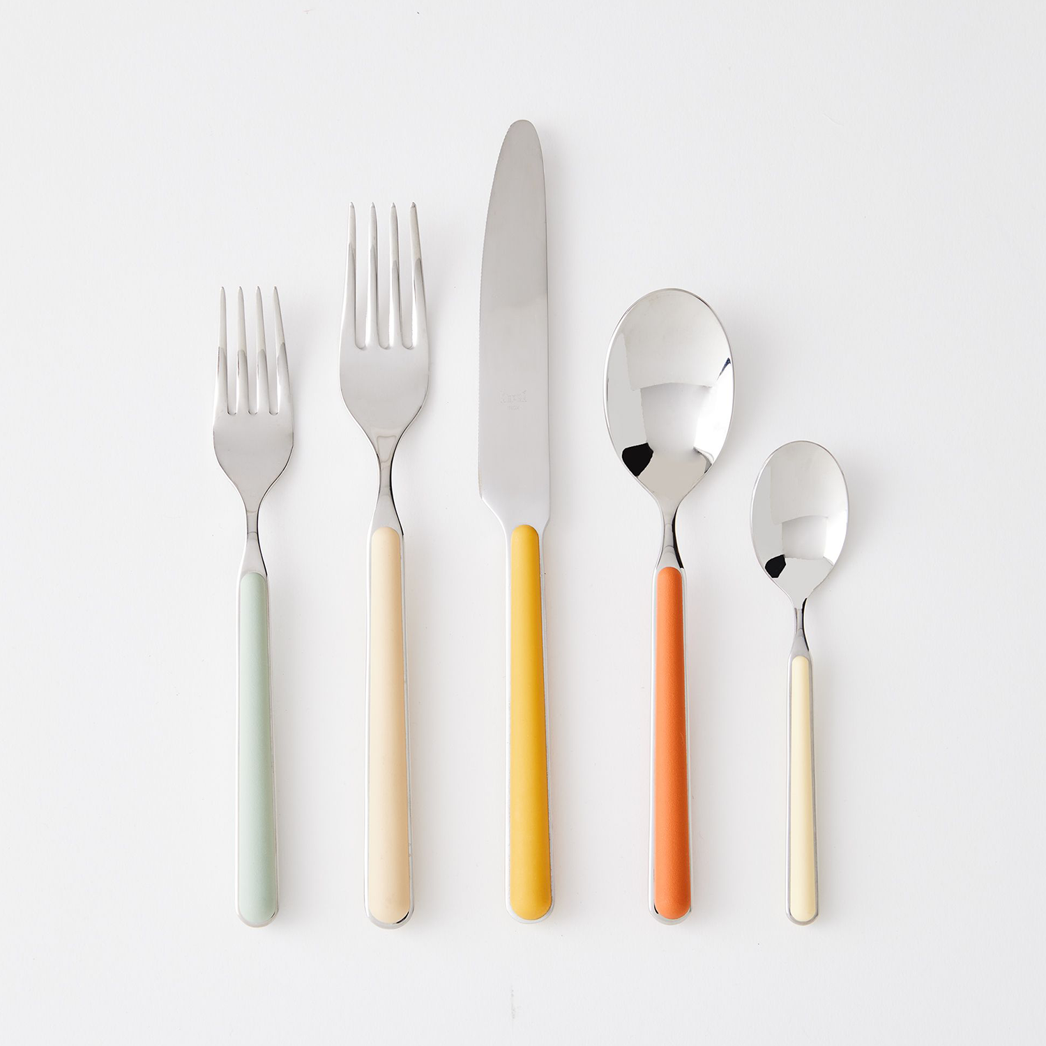 five pieces of flatware with different color handles