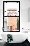 minimalist bathroom white bathroom with black window panes and tub