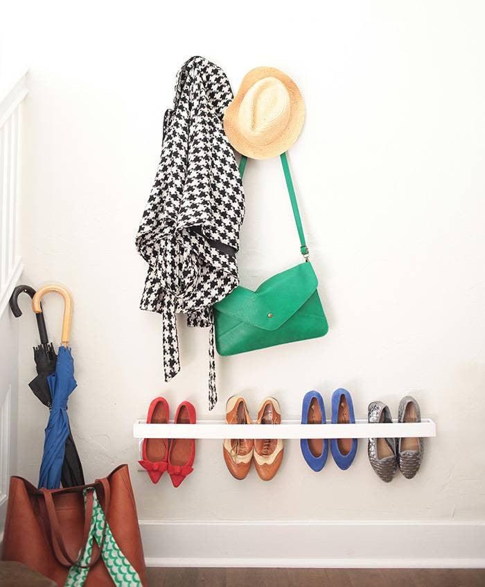 clever shoe storage shoes stored on a wall shelf