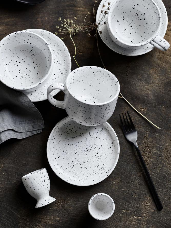 black and white speckled dinnerware