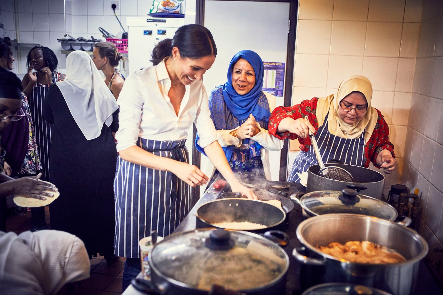 Meghan Markle with women from The Hubb Community Kitchen
