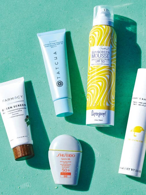 sunscreens on a green background