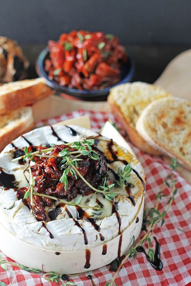 8 Delicious Camembert Recipes To Try Before It Goes Extinct - baked camembert with black garlic and balsamic sun-dried tomatoes