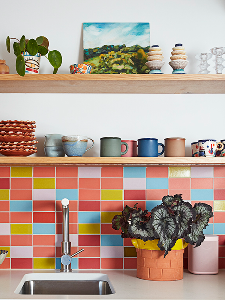 colorful kitchen backsplash with coffee mugs on open shelves
