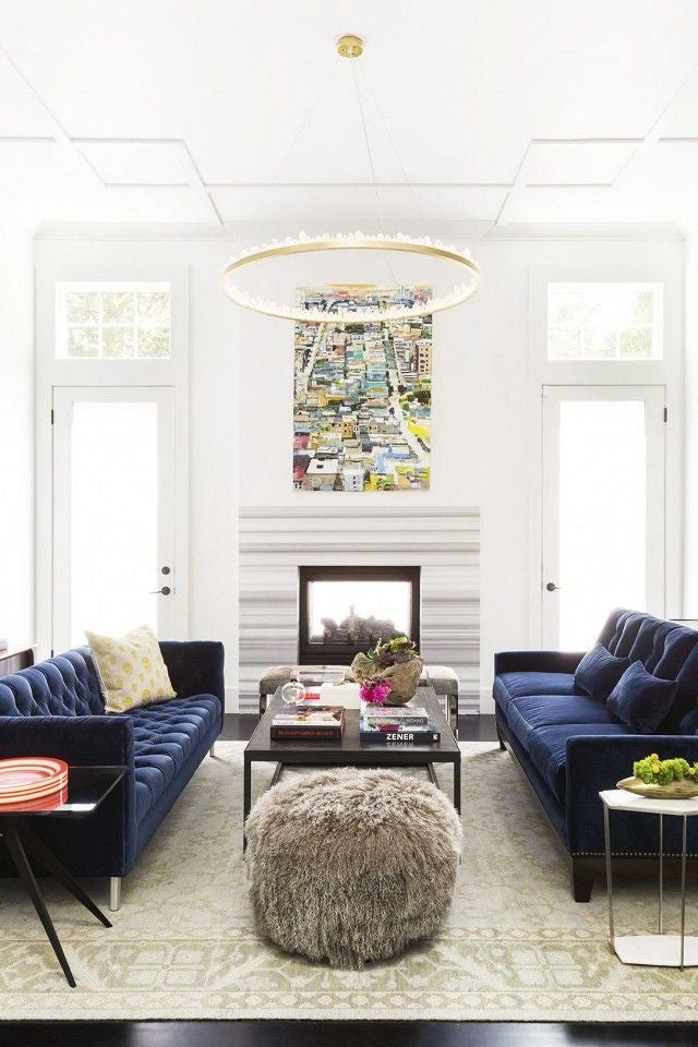 white living room with navy couches