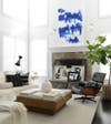 mantel decorating ideas for spring white living room with blue art over mantel