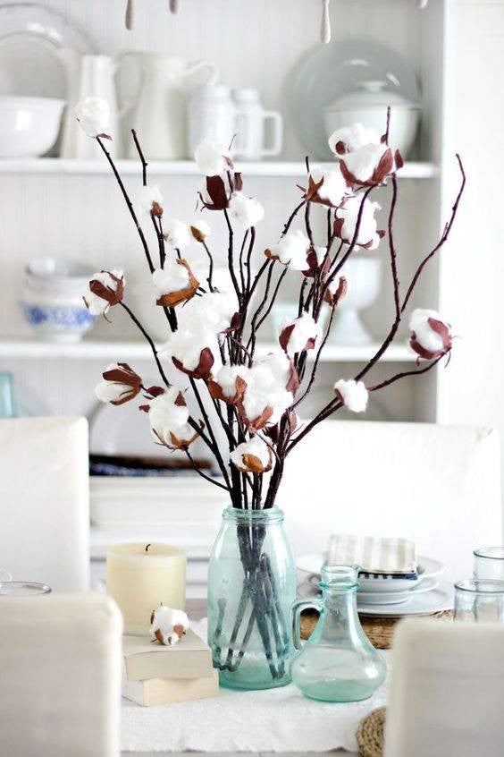 Easy Spring Centerpieces cotton branches in bottles centerpiece