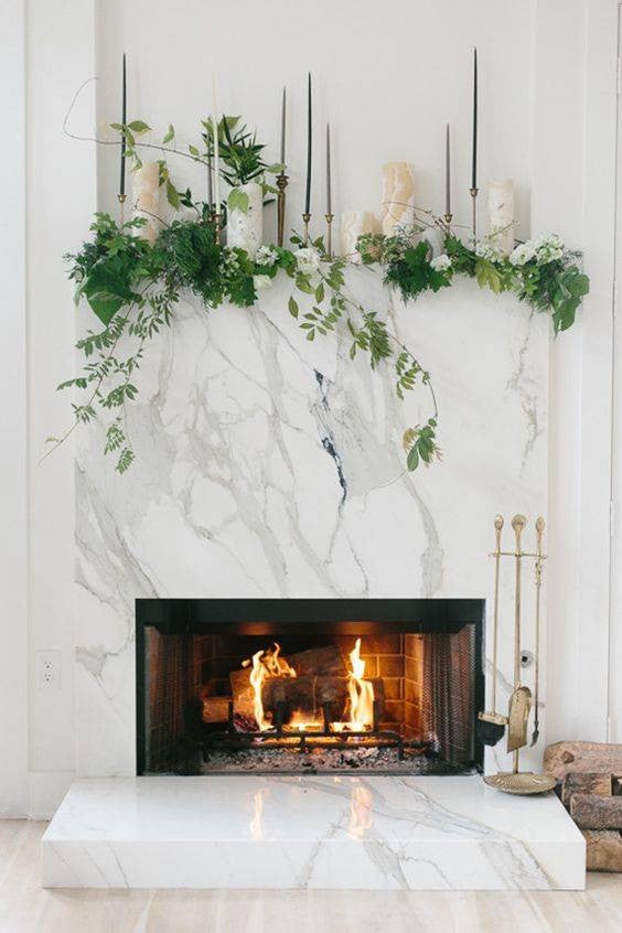 mantel decorating ideas for spring greens and candles on white mantel