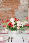 Spring Flower Arrangements white and red flowers on a table