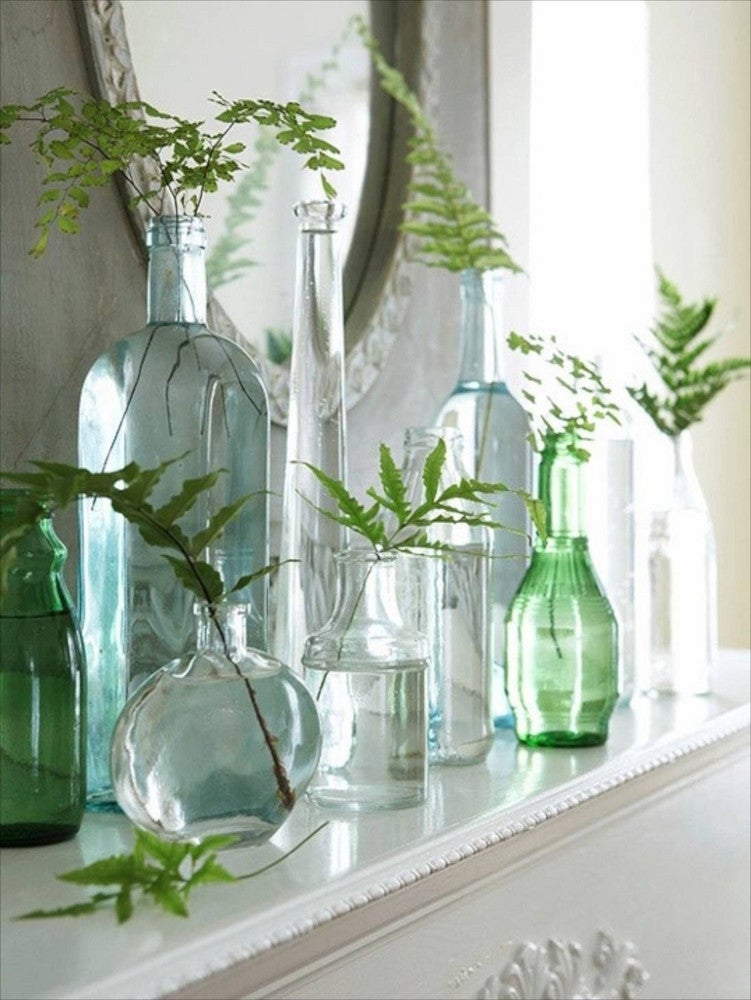 mantel decorating ideas for spring sea blue bottles and green fillers
