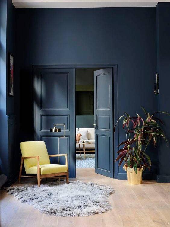 home paint ideas navy entry with yellow chair