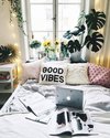 domino magazine bedroom with good vibes pillow