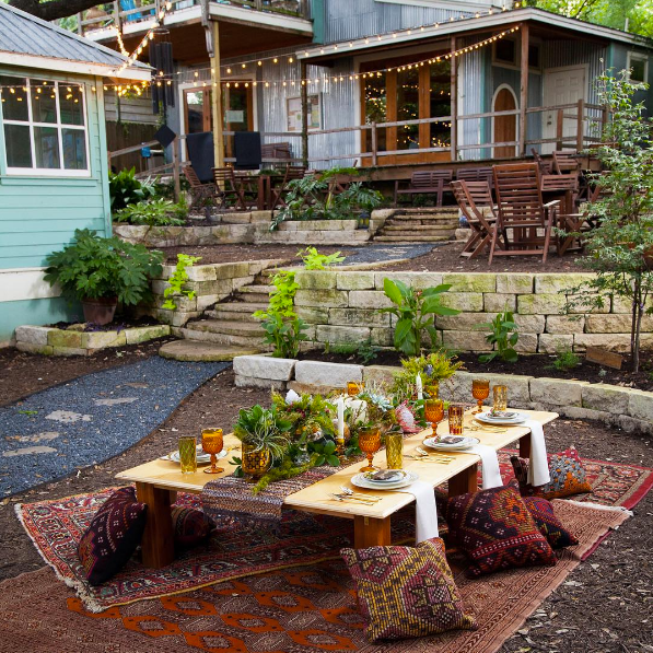 domino magazine backyard with picnic table