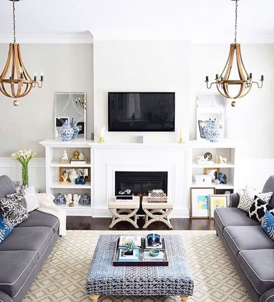 domino magazine white living room with gray sofas