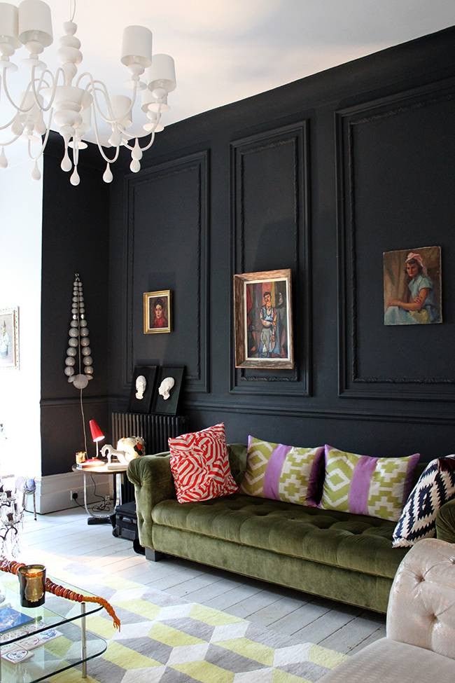 black rooms black living room with green sofa
