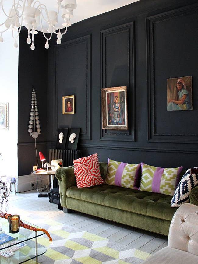 black rooms black living room with green sofa