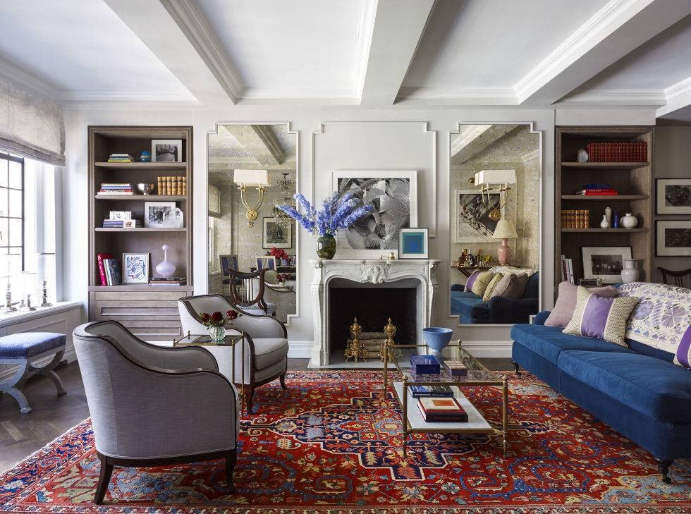 emmy rossum white living room with red and blue rug
